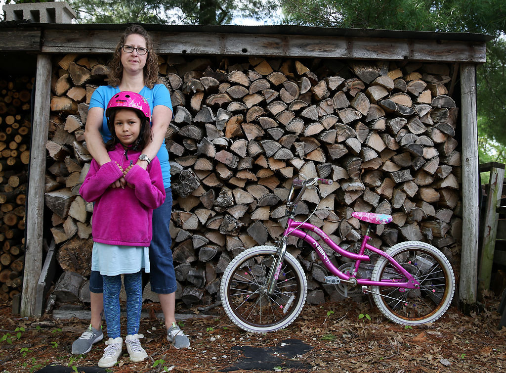 Kim Arcelona and her daughter Naomi, 8, live within sight of the Labadie Energy Station
